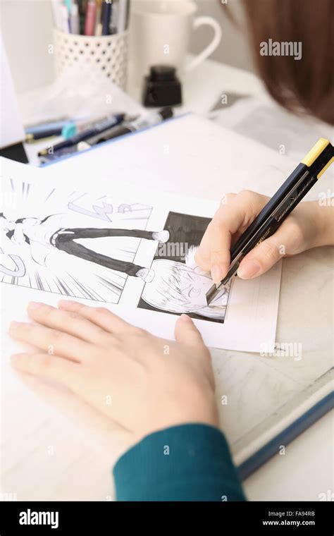 Japanese Manga artist working in the studio Stock Photo - Alamy