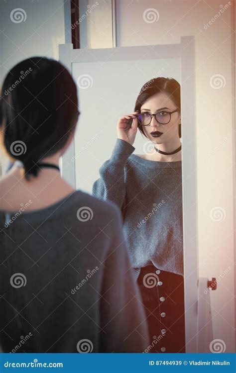 Beautiful Young Woman Standing In Front Of Mirror And Looking At Stock Image Image Of