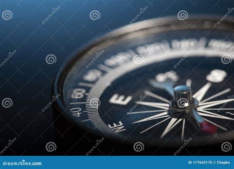 Vintage Magnetic Compass Compass On Blue Background Macro Photo Stock