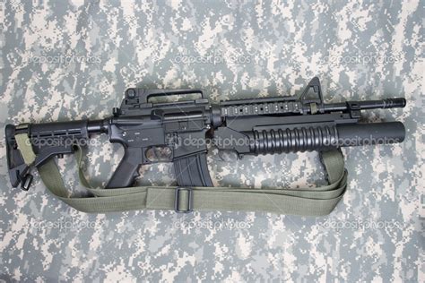 M4A1 carbine equipped with an M203 grenade launcher Stock Photo by ...