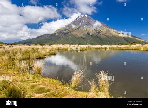 Mountain lake with the Mount Taranaki volcano, Pouakai Range, Egmont National Park, Taranaki ...