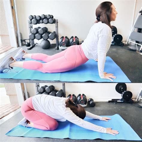 Two Women Doing Exercises On Exercise Mats With Dumbbells In The