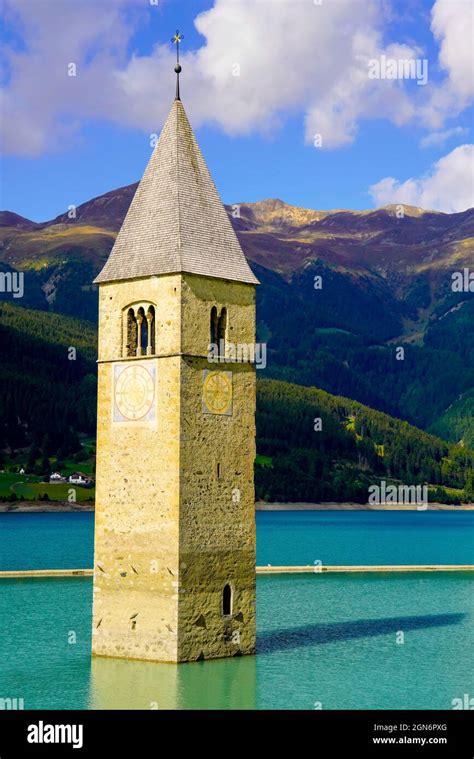 Only The Lone Bell Tower Church Shoots Up From The Water Of The Lake In