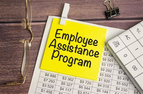 Eap Employee Assistance Program On Yellow Sticker And Calculator And