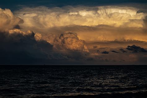 Yesterday's storm clouds leaving the city and heading over the lake ...