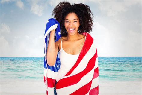 Composite Image Of Pretty Girl Wrapped In American Flag Smiling At