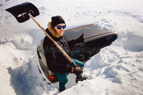 Man Cleans Snow And Cleans Car Shovel From Snow Stock Image Image Of