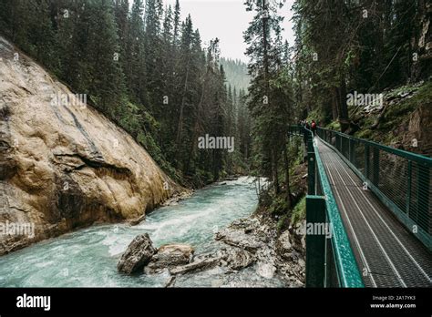 Metal Catwalk Running Along The Rushing Water In Johnston Canyon Stock