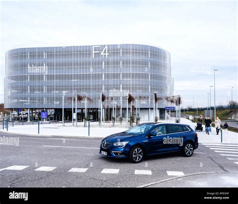 BASEL, SWITZERLAND - MAR 22, 2018: Blue Renault car entering modern F4 ...