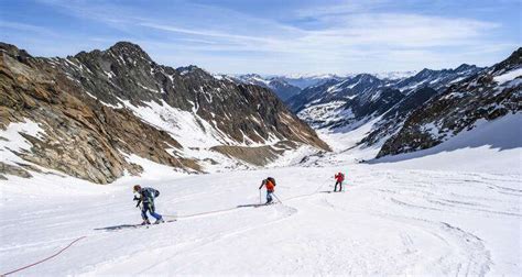 Skitourengeher On Ascent With Rope On Glacier Mountains At Winter With