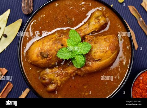 Desi Chicken Masala Curry In Bowl Chicken Leg Piece Stock Photo Alamy