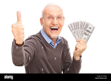 Excited Senior Gentleman Holding A Stack Of Money And Giving A Thumb Up