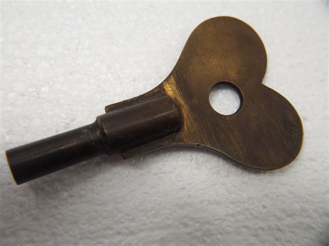 antique fusee clock   brass key antique price guide details page