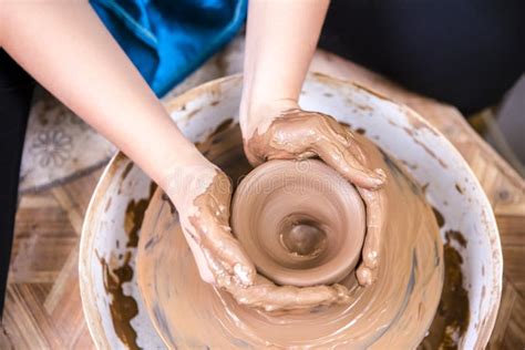 Hands Of Experienced Female Potter Working With Clay Posing With Clay