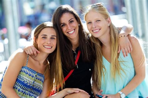 Group of beautiful young girls in the street. Shopping day. Photo ...