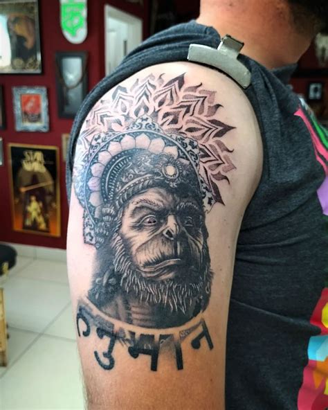 a man with a tattoo on his arm that has an image of a gorilla wearing a ...