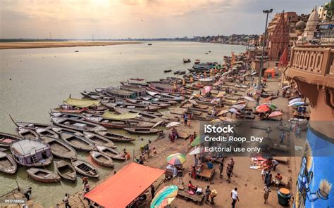 Aerial View Of Varanasi Ganges River Ghat With Wooden Boats Stock Photo