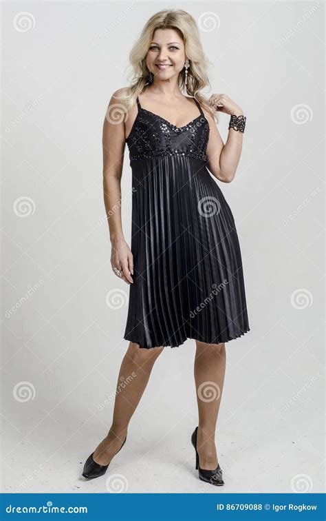 Beautiful Blonde Woman In A Black Cocktail Dress Stock Photo Image Of Model Hair