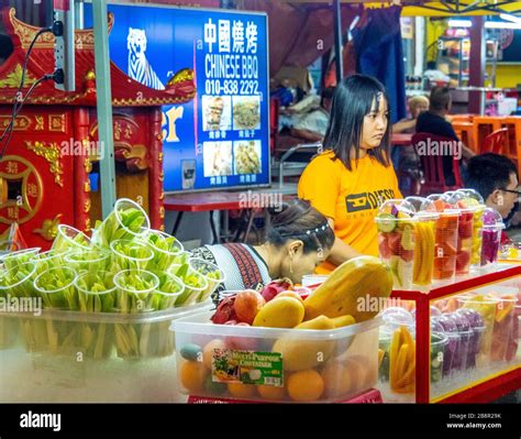 Two Women Vendors Stallholders In A Fresh Fruit Juice Bar In Jalan Alor