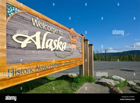 Alaska highway sign. Border Yukon-Alaska. Canada-USA Stock Photo - Alamy