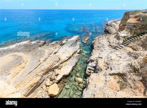 Picturesque Seascape With White Rocky Cliffs Caves Sea Bay And Islets