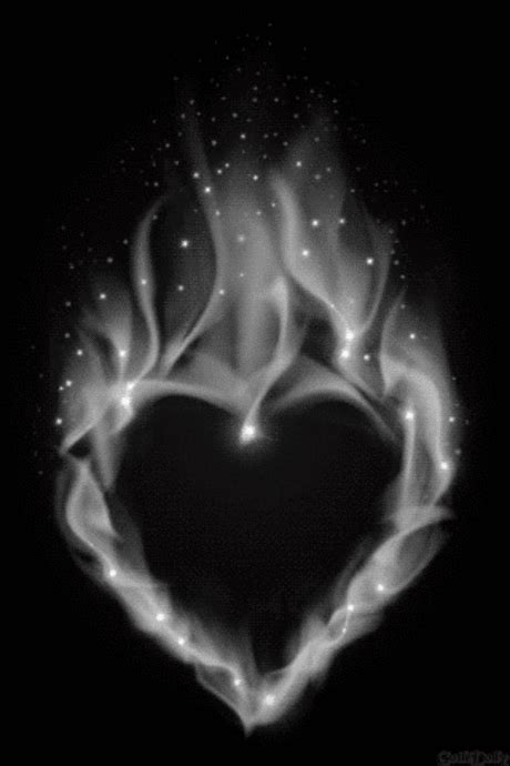 A Black And White Photo With A Heart Made Out Of Flames In The Shape Of