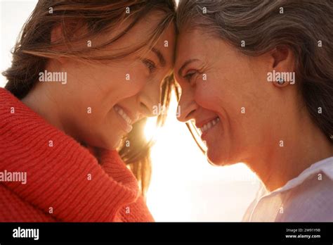 Loving Mother And Daughter Touching Foreheads To Each Other Stock Photo