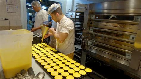 Bakery In Lisbon Making The Famous Cream Tarts Called Pasteis De Nata