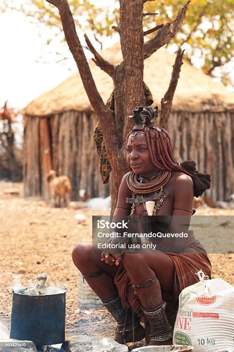 Himba Woman Cooking In His Village Near Epupa Falls Namibia Stock Photo