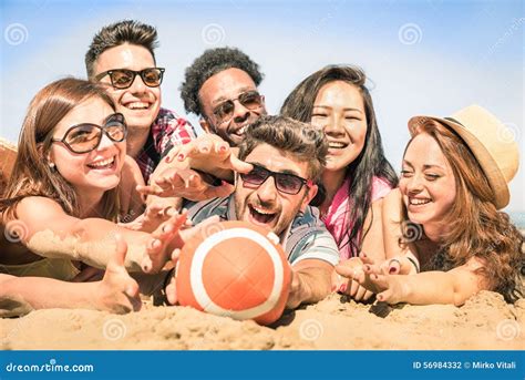 Group Of Multiracial Happy Friends Having Fun At Beach Games Royalty