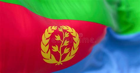 Close Up View Of The Eritrea National Flag Waving In The Wind Stock