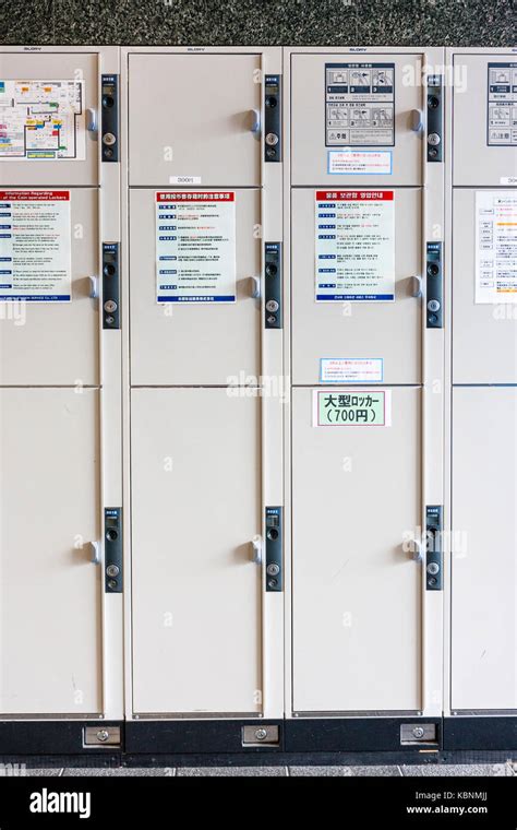 Japan, Kyoto. Kyoto station, three sizes of lockers stacked atop of ...