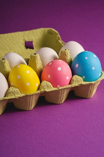 Premium Photo Colorful Polka Dot Easter Eggs In Egg Tray On Purple