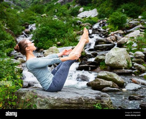 Woman Doing Ashtanga Vinyasa Yoga Asana Navasana Boat Pose Stock