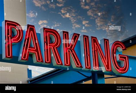 Neon Red Parking Sign Stock Photo - Alamy