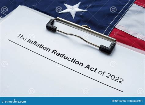 Papers With The Inflation Reduction Act And US Flag Royalty Free Stock