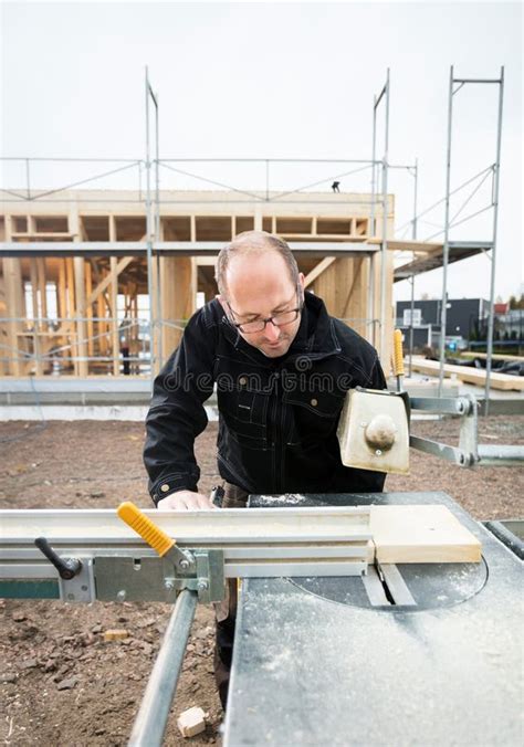 Carpenter Using Table Saw To Cut Wood At Site Stock Photo Image Of