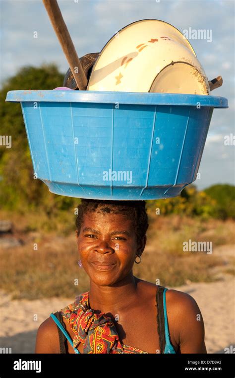 African Woman Carrying Bucket On Head Hi Res Stock Photography And