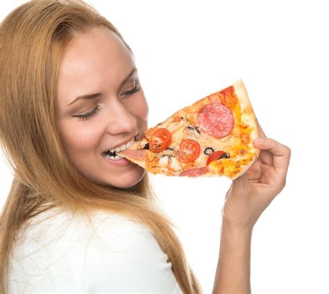 Happy Woman Enjoy Eating Slice Of Pepperoni Pizza With Tomatoes Stock