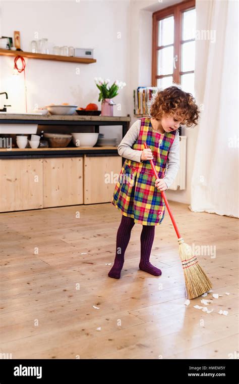 Cute Girl Sweeping Kitchen Floor Stock Photo 136162151 Alamy