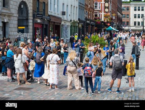 Crowd Of People Gathered To Watch Street Entertainer Covent Garden