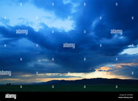 Dark storm-clouds at sunset Stock Photo - Alamy