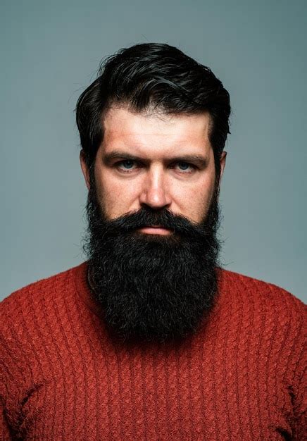 Premium Photo Portrait Of Confident Serious Man Has Beard And Mustache Looks Seriously