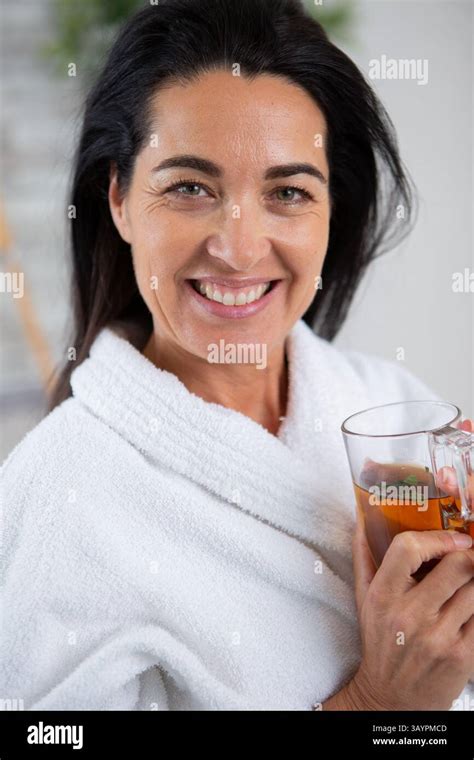 Beautiful Brunette Drinking Herbal Tea After Spa Procedures Stock Photo Alamy
