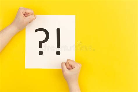 Question Mark And Exclamation Mark On Yellow Background Flat Lay