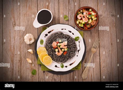 Squid ink risotto Stock Photo - Alamy