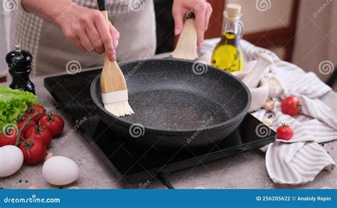 Woman Spreading Butter On The Hot Frying Pan With A Silicone Brush Stock Footage Video Of