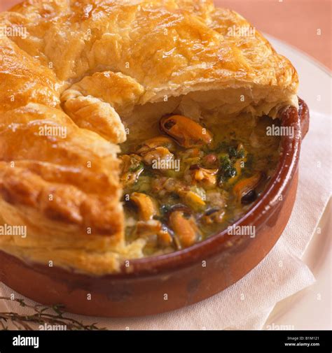 Seafood pie with puff pastry crust Stock Photo - Alamy