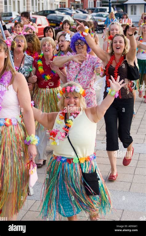 Women dressed in hula skirts on Hawaiian style hen night Aberystwyth ...