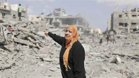 During cease-fire, Gaza residents survey destruction | PBS NewsHour ...